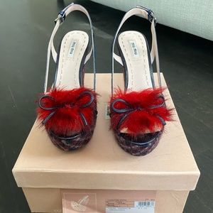 Miu Miu platform sandals.